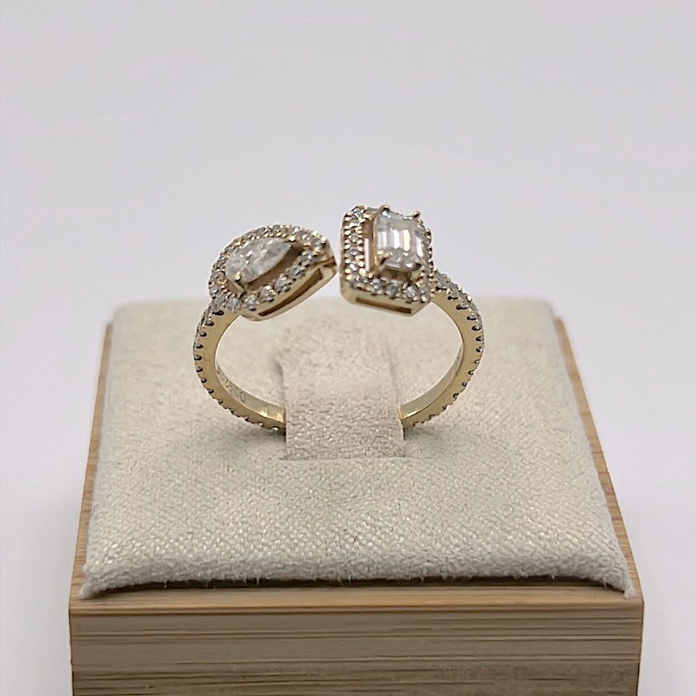 Unique Emerald and pear cut twin diamond engagement ring